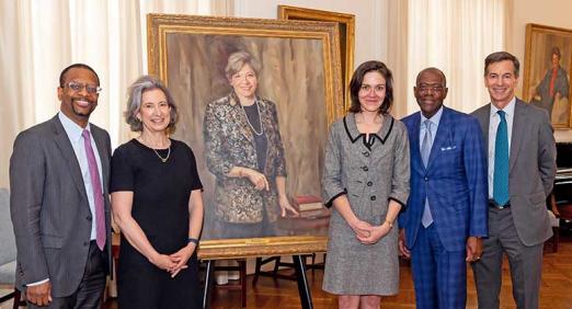 Former colleagues and friends of the late Florence Davis in front of her portrait in Greenberg Lounge