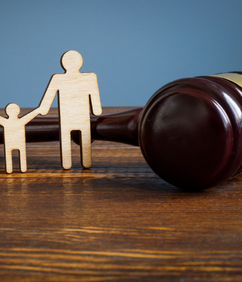 Rendering of family law—figurines alongside a gavel
