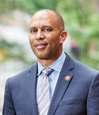 Hakeem Jeffries standing in front of Brooklyn brownstones