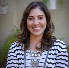 Woman with medium length dark hair smiling