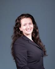 Headshot of Rebecca Guterman wearing business suit and smiling.