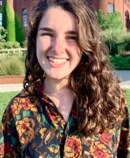 person with mid-length hair smiling