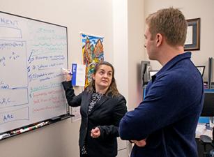 Ashley Binetti Armstrong and a student