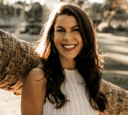 Woman with long dark hair smiling