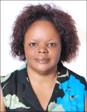 Black woman with short hair smiling at the camera
