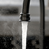 Water flowing from a faucet.