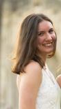 A headshot of Kate Evans smiling at the camera