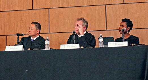 Judges at table listening