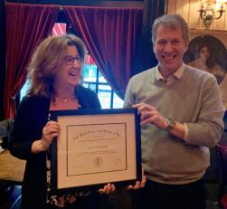 Lisa Waldman accepting Podell award from Dean Trevor Morrison.